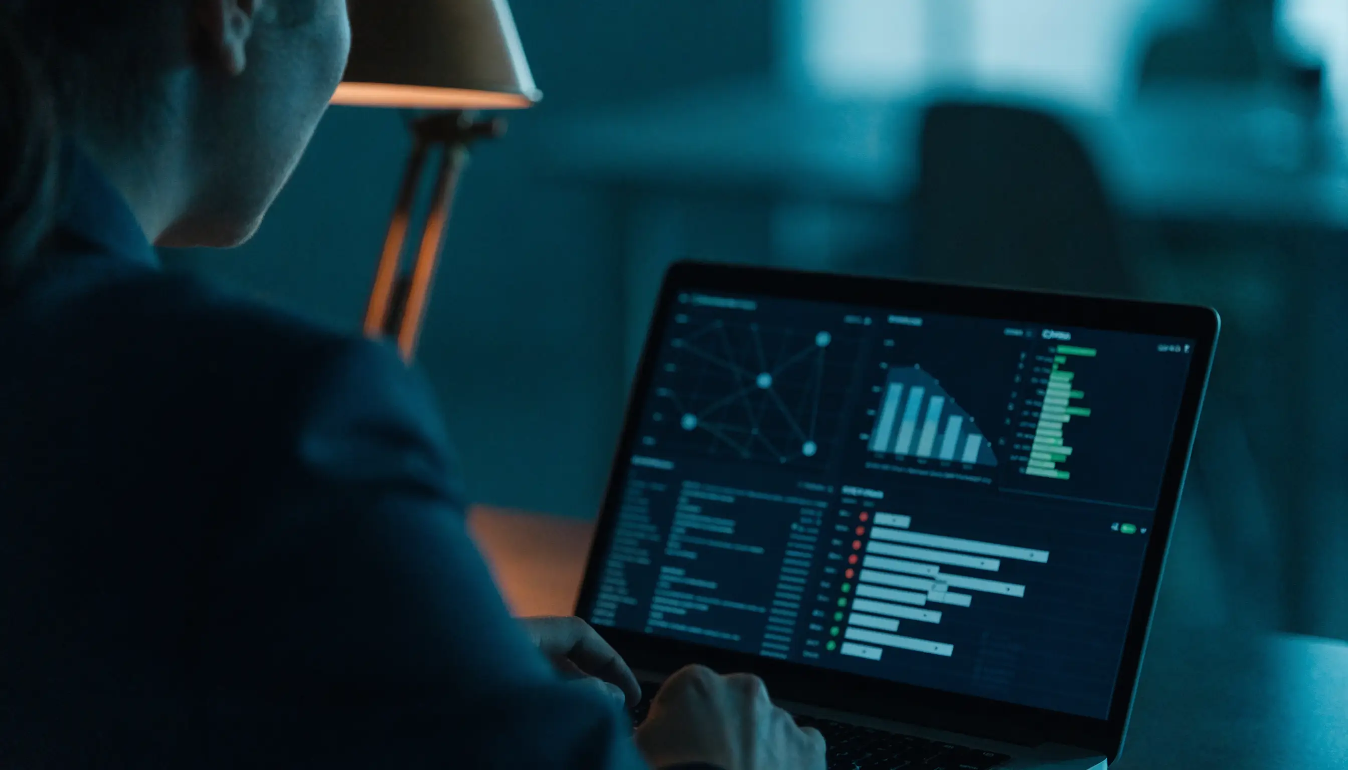 Penetration tester reviewing a security dashboard with network graphs and severity ratings
